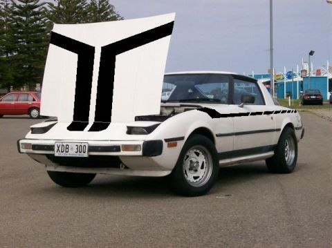1983 Mazda RX-7 - This white Mazda RX-7 features distinctive black racing stripes on the hood and sides.