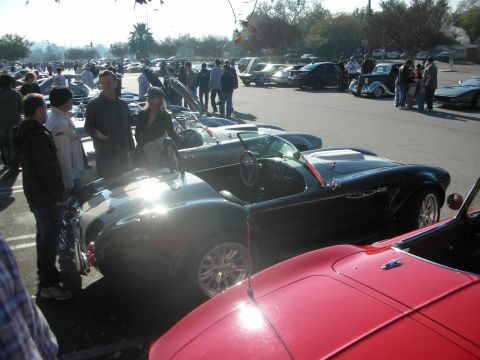 1998 Ford Crown Victoria - A gathering of classic sports cars and enthusiasts at an outdoor event.
