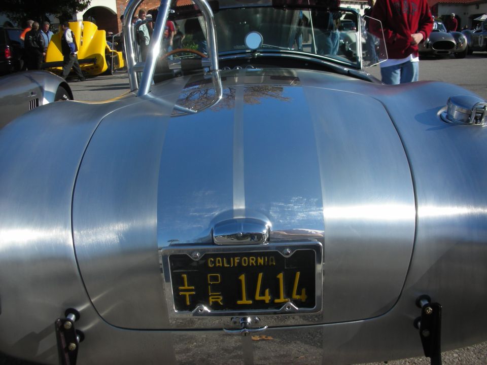 Silver Cobra rear deck with California license plate reading 1414
