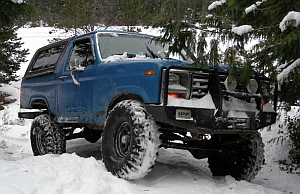 1986 Ford Bronco - 1986 Ford Bronco in a snowy outdoor setting, modified for off-road use.
