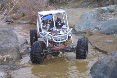 1994 Ford Bronco - This off-road buggy navigates a rocky stream bed.