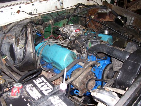 1979 Ford Bronco - Close-up view of a vehicle's engine bay, showing various components and wiring.