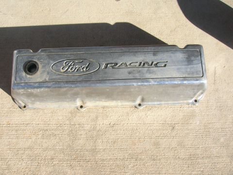 1979 Ford Bronco - Ford Racing valve cover shown on a concrete surface.