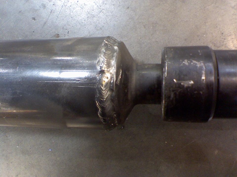 Drive shaft with visible welds and a dark metal yoke