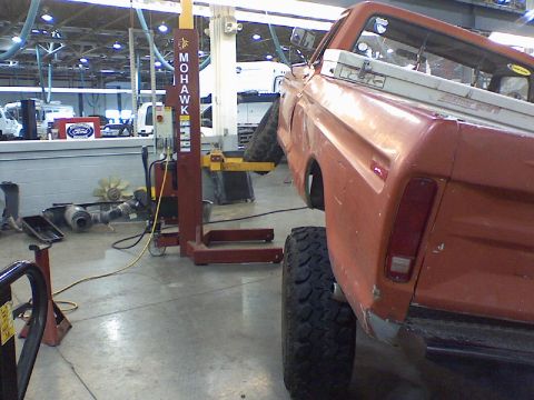1974 Ford F-250 - This pickup truck is on a lift in a garage. A toolbox is in the bed.
