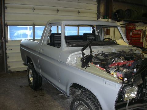 1979 Ford Bronco - This 1979 Ford Bronco is undergoing restoration, with its hood open revealing the engine bay.