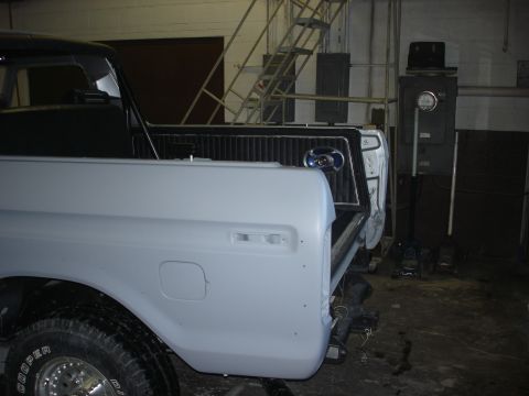 1979 Ford Bronco - Rear view of an unpainted 1978 Ford Bronco showing the quarter panel and tailgate area.