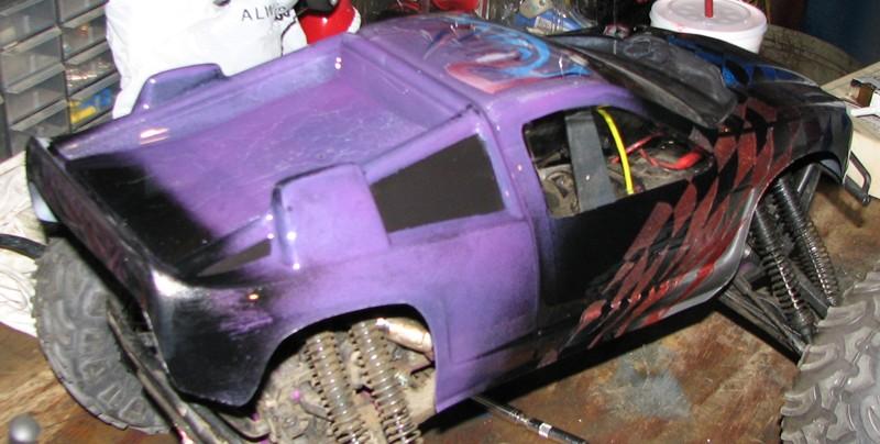 Purple and black remote control monster truck with custom paint