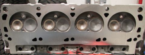 1980 Ford Bronco - Close-up view of an engine cylinder head, showing the intake and exhaust valves.