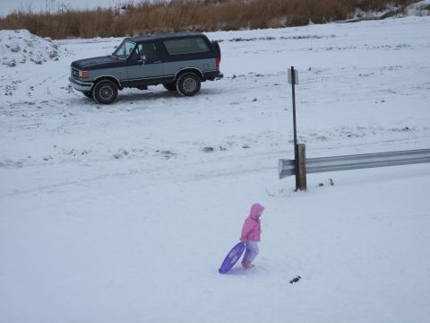 1990 Ford Bronco - Amelia sledding with bronco