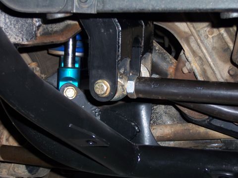 1980 Ford Bronco - Aftermarket suspension parts are visible in this close-up view of a vehicle's undercarriage.