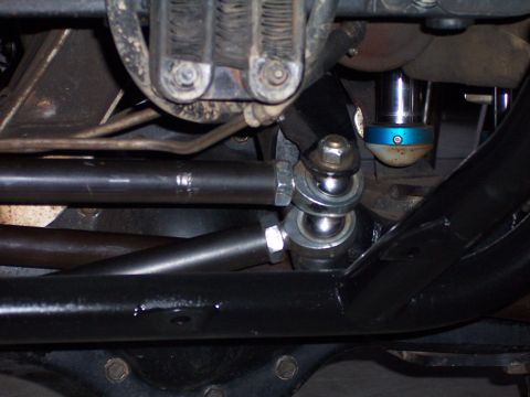 1980 Ford Bronco - Undercarriage view shows the steering system and suspension components of a vehicle.