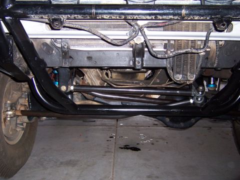 1980 Ford Bronco - Close-up view of the front suspension and steering system of an off-road vehicle.