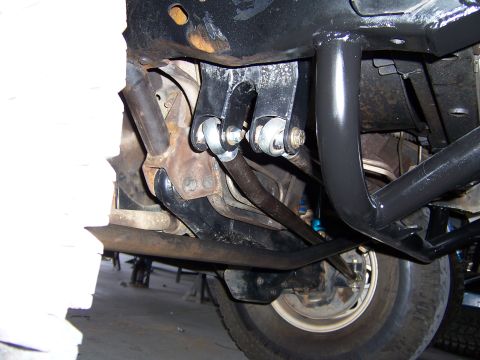 1980 Ford Bronco - Close-up of suspension parts, likely from a truck or SUV, showing aftermarket modifications.