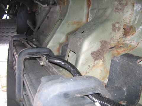 2001 Ford F-150 - Harness Location underneath Passenger side, held in by running board mounts.