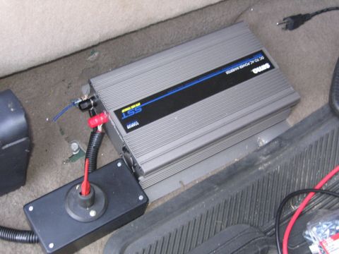 2001 Ford F-150 - A DC to AC power inverter is visible, installed on the floor of a vehicle's interior.