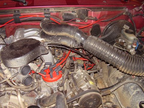 1994 Ford Bronco - Close-up view of an engine bay, showing various components and wiring.