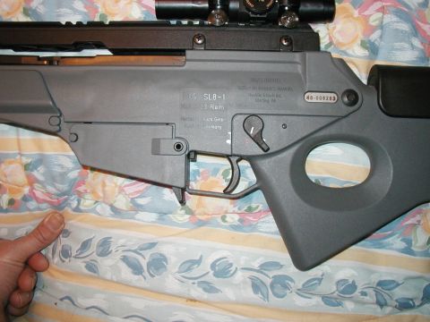 1993 Ford Bronco - A Heckler & Koch SL8-1 rifle is shown in detail, with visible markings and a scope mounted on top.