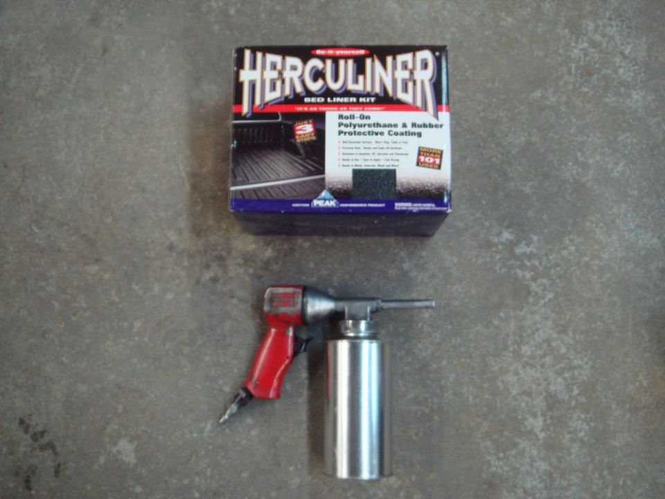 Herculiner bed liner kit box and a red and silver air sprayer tool on a concrete surface