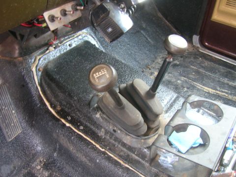 1979 Ford Bronco - Interior view of twin stick shifters, likely for a 4x4 vehicle, with a visible gear selection diagram.