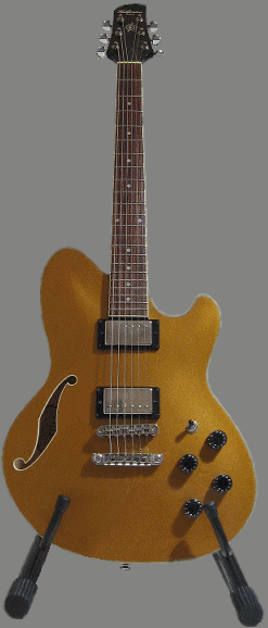 1995 Ford Bronco - A gold electric guitar is displayed on a stand against a neutral background.