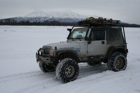 2003 Jeep TJ - 2003 Jeep TJ Rubicon equipped for winter conditions, parked in a snow-covered landscape.