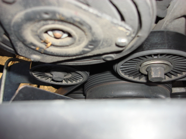 well i was getting a bad chipmonk sound from under the hood. each time i started Brutis iit sound like a hamster wheel. it would go away after a few miles and the motor temp climbs. here are the stock pulleys. there is one below the ac/compressor and one next to the ac compressor on the tensioner.