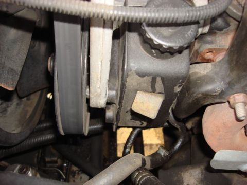 1983 Ford Bronco - here is a closer view of the old pump and hoses. you can see a leak the old hoses had.