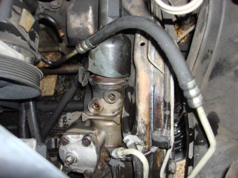 1983 Ford Bronco - there are 2 nuts on the back of the pump that need to come off or do like me remove the bracket===2 exhaust nuts and an alt bolt. then put…