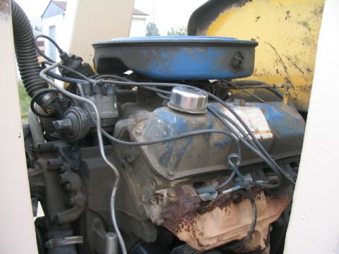 1979 Ford F-150 - Close-up view of an engine bay, showing the air cleaner and engine block.