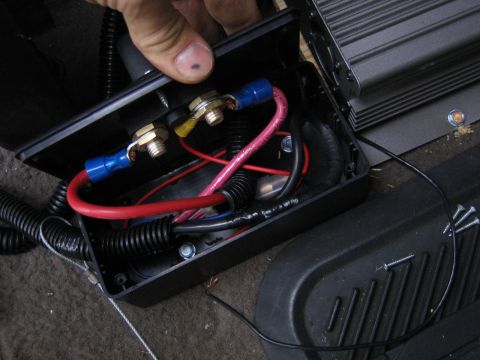 2001 Ford F-150 - Close-up of a black electrical box containing wiring and terminals, likely part of a vehicle's electrical system.