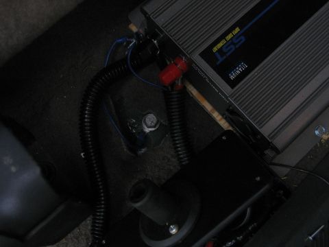 2001 Ford F-150 - Close-up of an SST Titanium power inverter installed in a vehicle's interior.