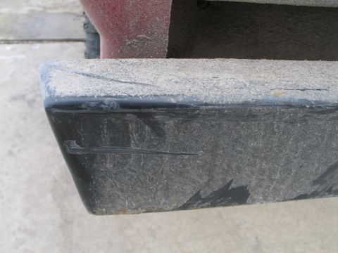 1995 Ford Bronco - Dusty rear bumper corner shows scuffs and wear.