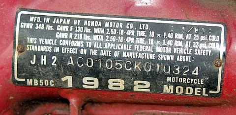 1985 Ford LTD Crown Victoria - Honda motorcycle VIN/data plate for a 1982 MB50C model showing GVWR, tire ratings, and the full identification number.