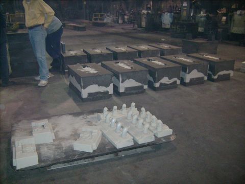 1969 Ford Fairlane - A factory floor displays multiple industrial molds and smaller white casting prototypes.