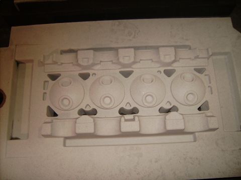 1969 Ford Fairlane - A mold for an engine cylinder head is shown, a series of circular openings.