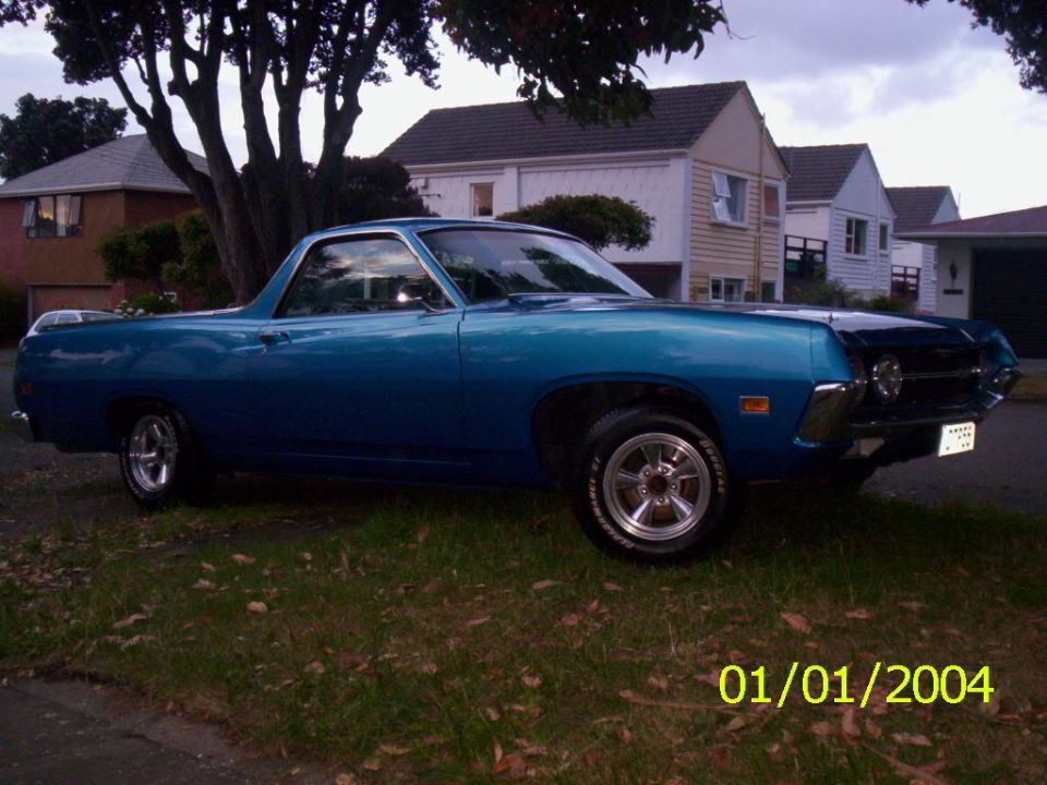 Blue 1970 Ford Ranchero parked in a residential area