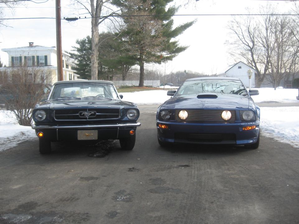 1965 Ford Mustang front view next to modern Mustang