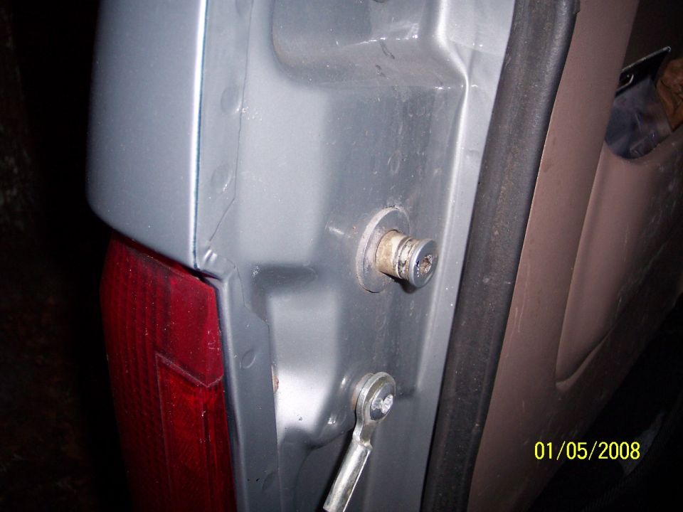 Tailgate latch mechanism with visible date stamp
