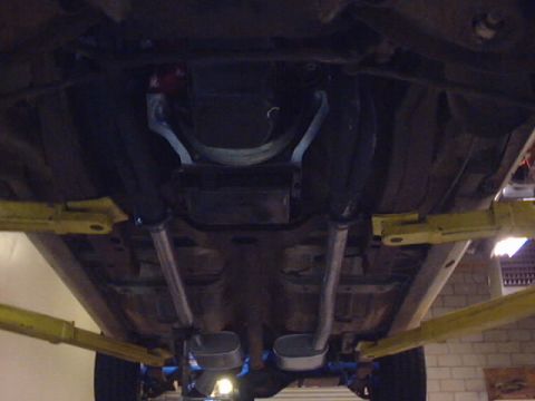 1969 Chevrolet Nova - Undercarriage view of a vehicle, showing the exhaust system and driveshaft. The registry information may be incorrect.