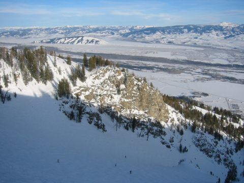 2006 BMW 5 Series - Winter mountain scene with skiers on a snowy slope, overlooking a valley and distant mountains.