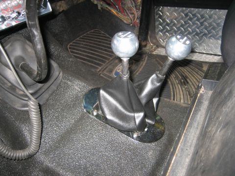 1990 Ford Bronco - Interior view of a 1990 Ford Bronco, focusing on the dual gear shift levers.