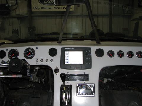 1980 Ford Bronco - Interior view of a custom dashboard with navigation and various gauges installed.