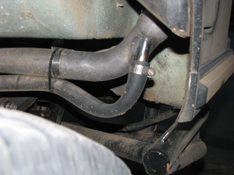 1980 Ford Bronco - Close-up view of hoses and frame components underneath a vehicle, with a watermark visible.