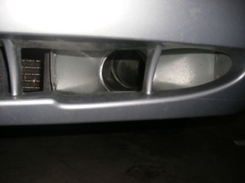 2001 Ford Crown Victoria - A detailed view of the front bumper area, showing an opening and a grille.