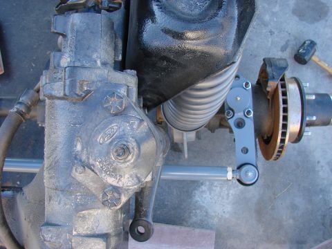 1979 Ford Bronco - Close-up view of a Ford steering gear box and front suspension components, including a disc brake rotor and caliper.