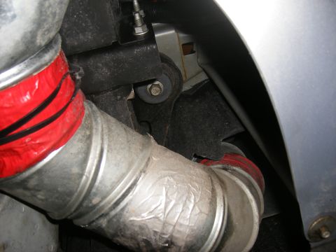 2001 Ford Crown Victoria - Exhaust pipe section with red insulation and silver tape visible.