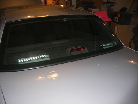 2001 Ford Crown Victoria - The rear window of a 2001 Ford Crown Victoria features two aftermarket LED light bars.