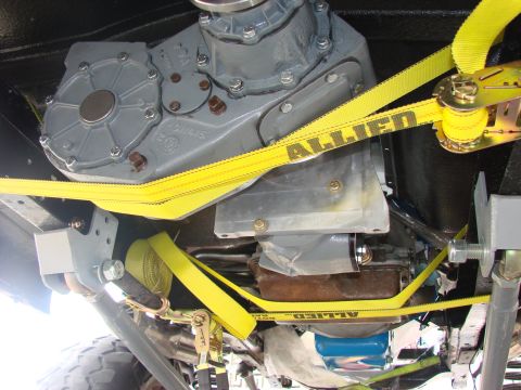 1979 Ford Bronco - Underside view of a vehicle's drivetrain, focusing on the transfer case and associated components.