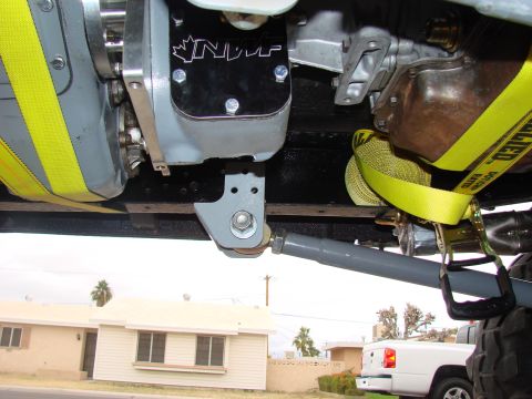 1979 Ford Bronco - Close-up of an NP205 transfer case doubler kit, showing mounting hardware and yellow straps.